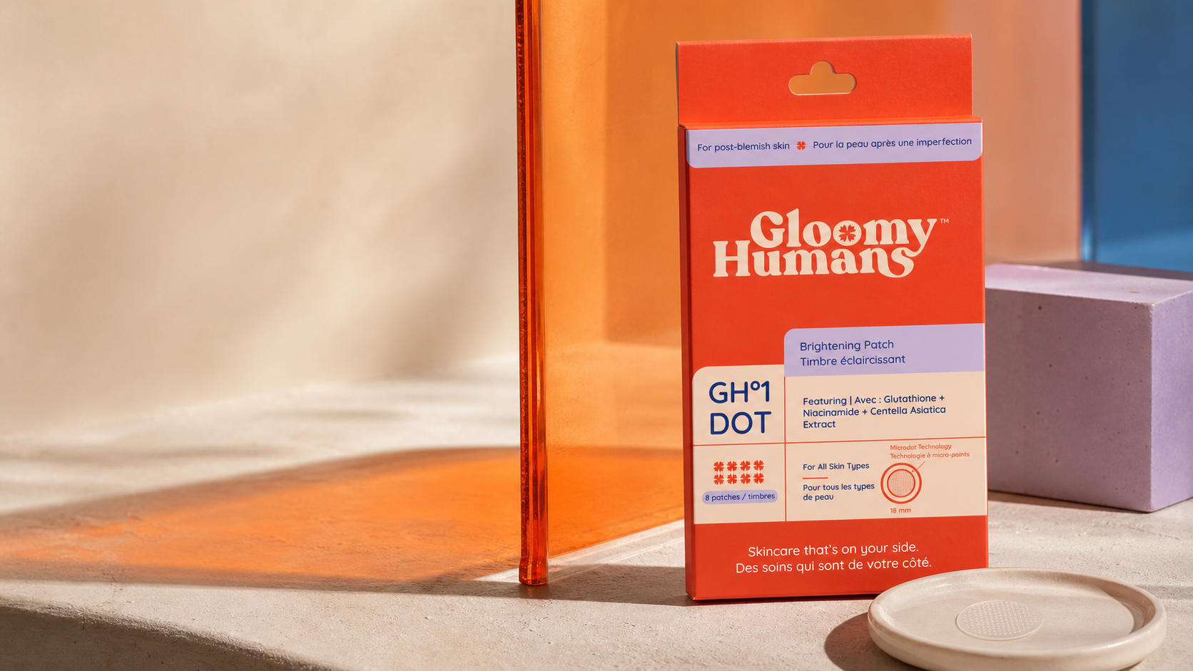 GH°1 DOT package in an orange and lavender campaign still life